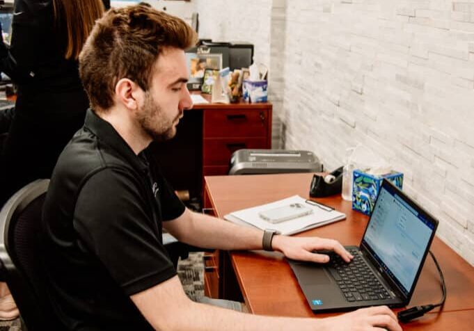 Interpro project manager applying subject matter expertise to review technical translation files at their desk
