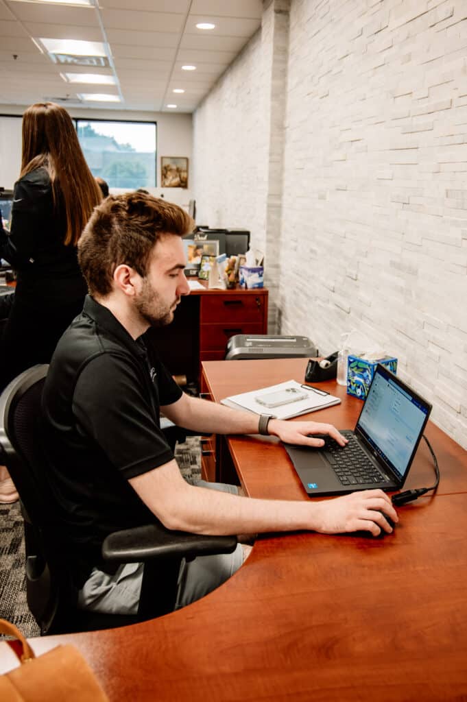 Interpro project manager applying subject matter expertise to review technical translation files at their desk