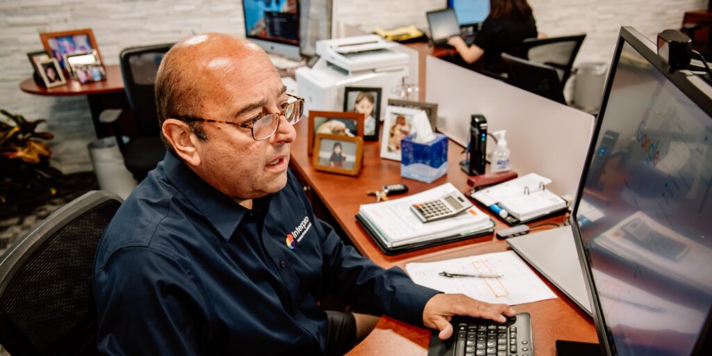 Interprospectives from Ralph Strozza, Interpro Founder sitting at desk