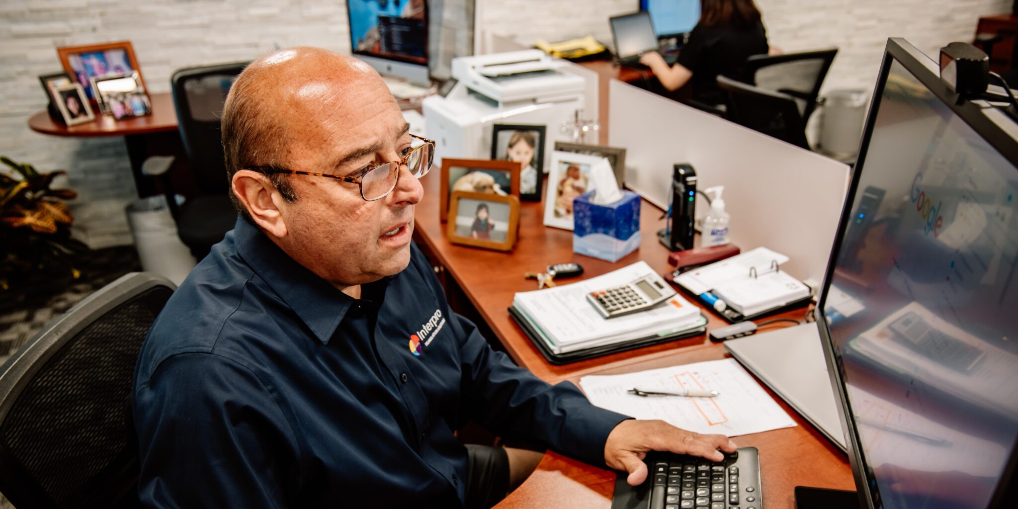 Interprospectives from Ralph Strozza, Interpro Founder sitting at desk