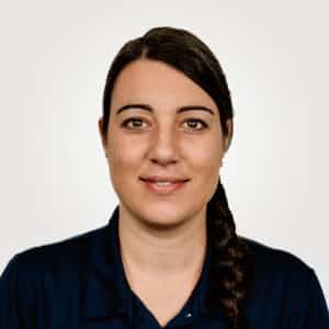 Arianna Martin, in project management at Interpro, smiling in a professional headshot wearing a black polo shirt.