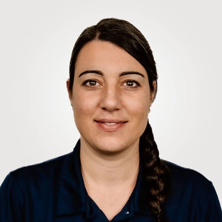 Arianna Martin, in project management at Interpro, smiling in a professional headshot wearing a black polo shirt.