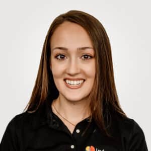 Eleanore Eye, in marketing management at Interpro, smiling in a professional headshot wearing a black polo shirt.