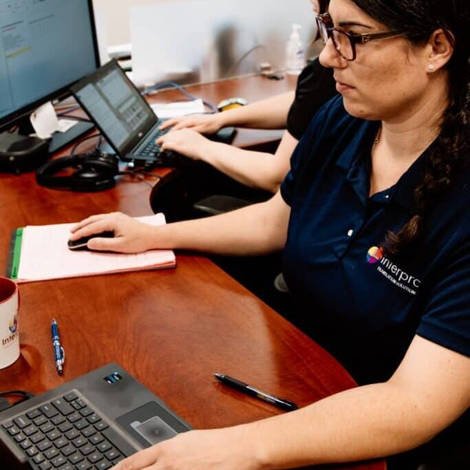 Interpro Employee Working On ELearning Translation