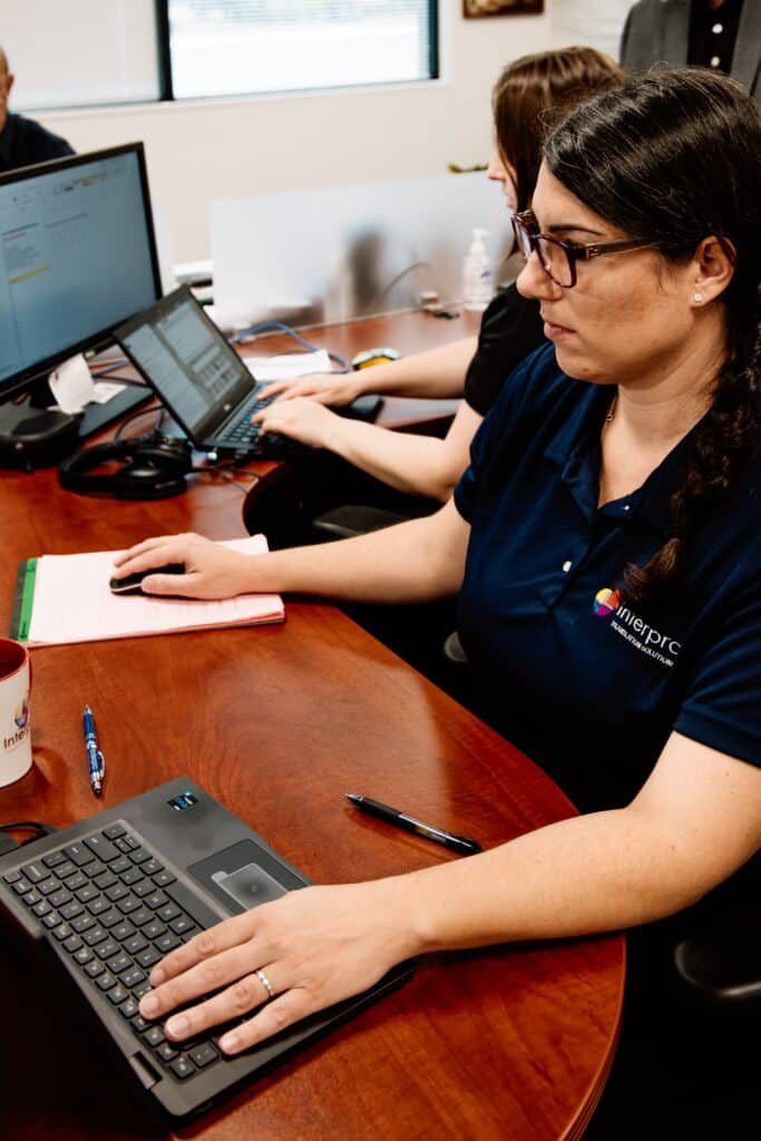 Interpro Employee Working On ELearning Translation