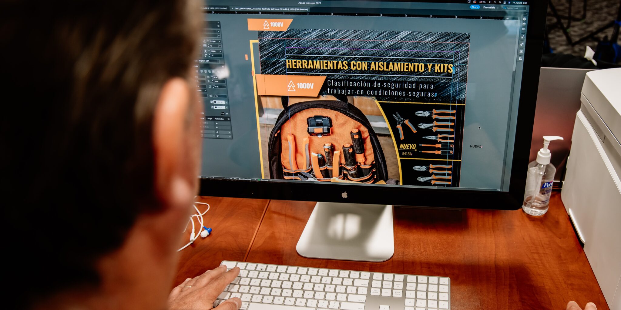 Designer working on a Spanish-language product packaging layout for Klein Tools