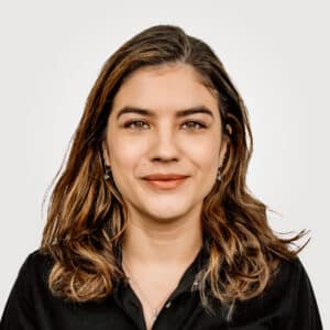 Jolie Parker , in project management at Interpro, smiling in a professional headshot wearing a black polo shirt.