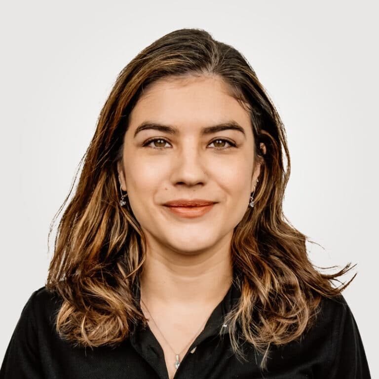 Jolie Parker , in project management at Interpro, smiling in a professional headshot wearing a black polo shirt.