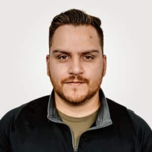 Mauricio Serrano, in office management at Interpro, smiling in a professional headshot wearing a black polo shirt.
