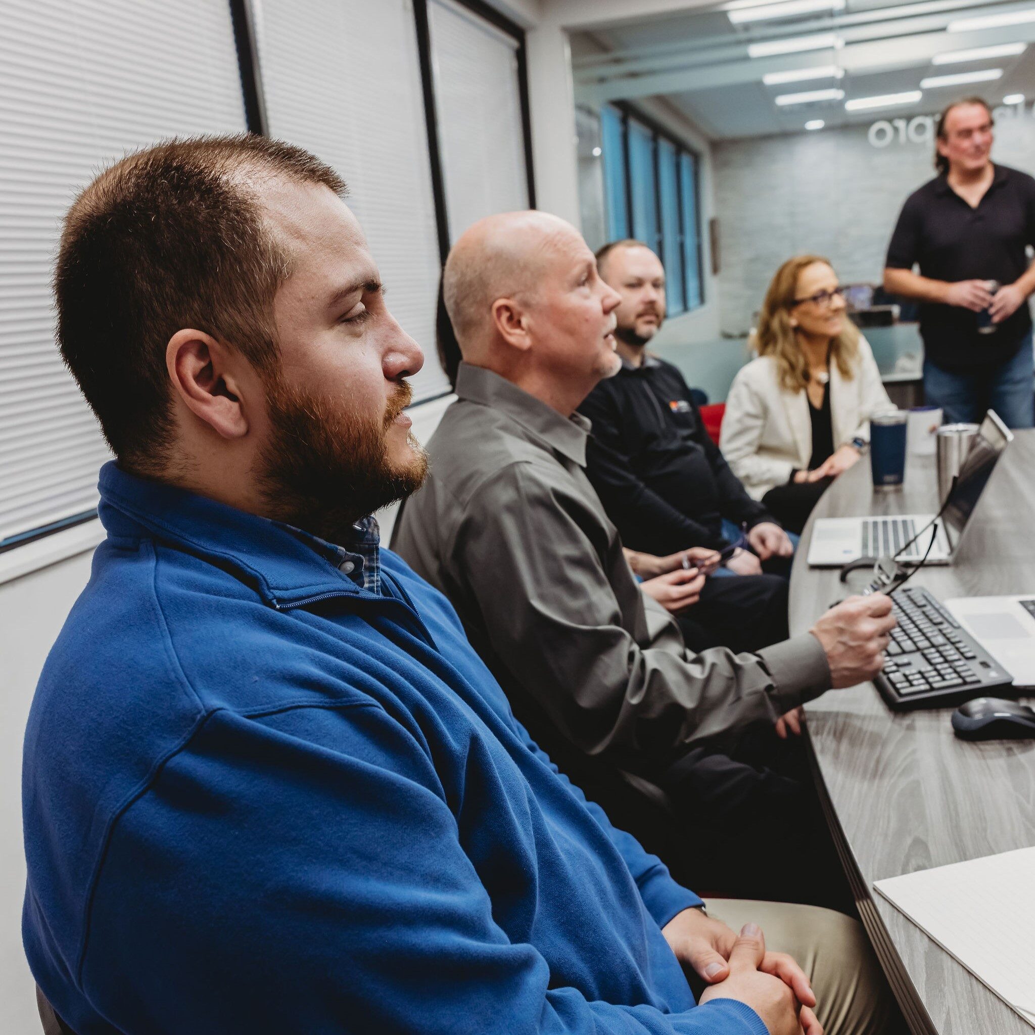 Professionals collaborating on AI-driven event interpreting solutions