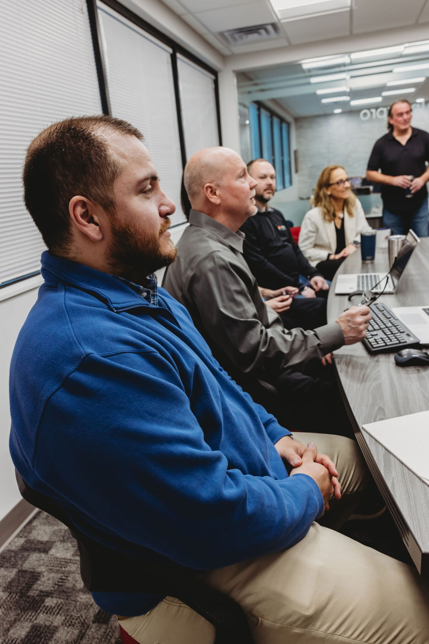 Professionals collaborating on AI-driven event interpreting solutions