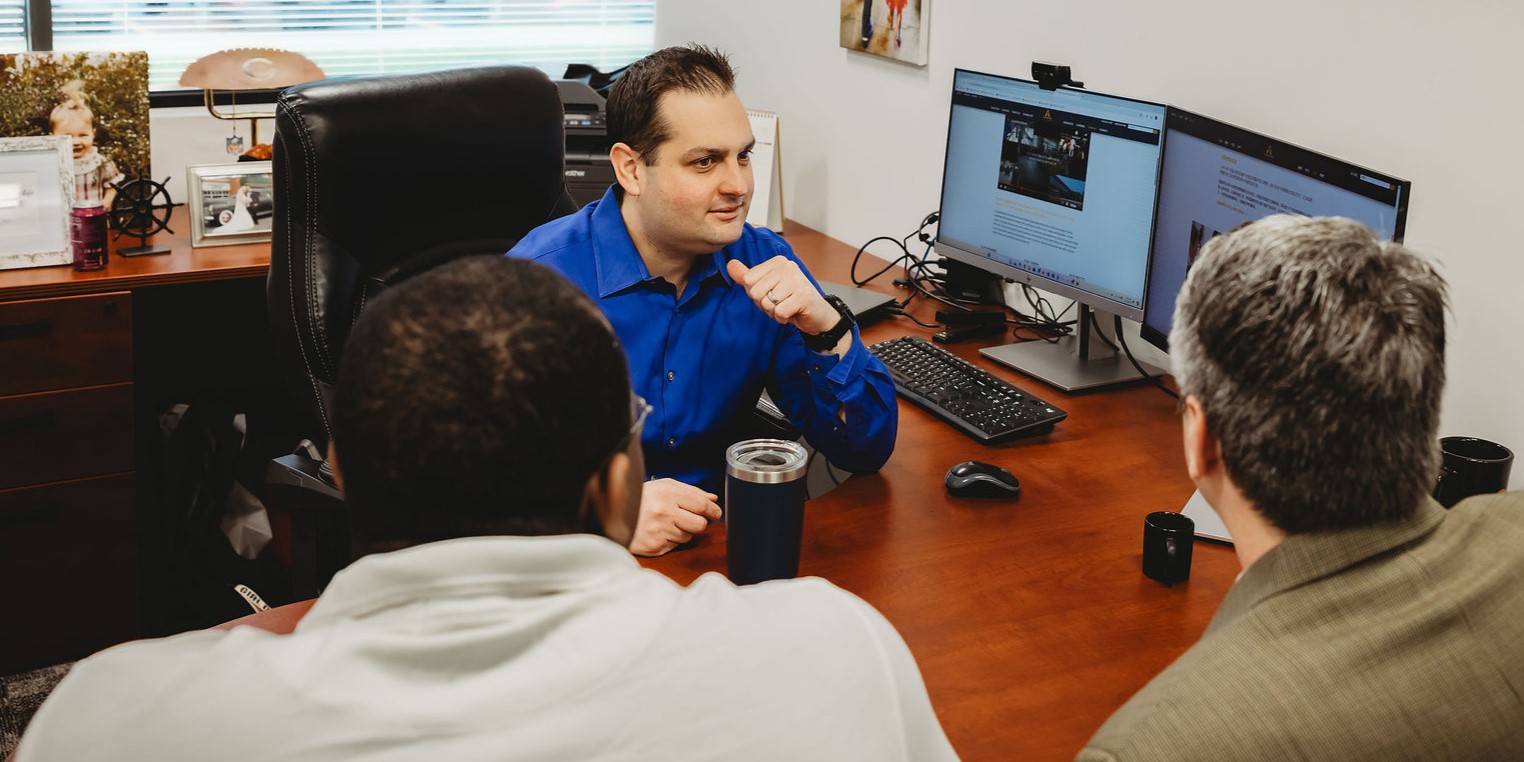 Interpro CEO in Office with Clients