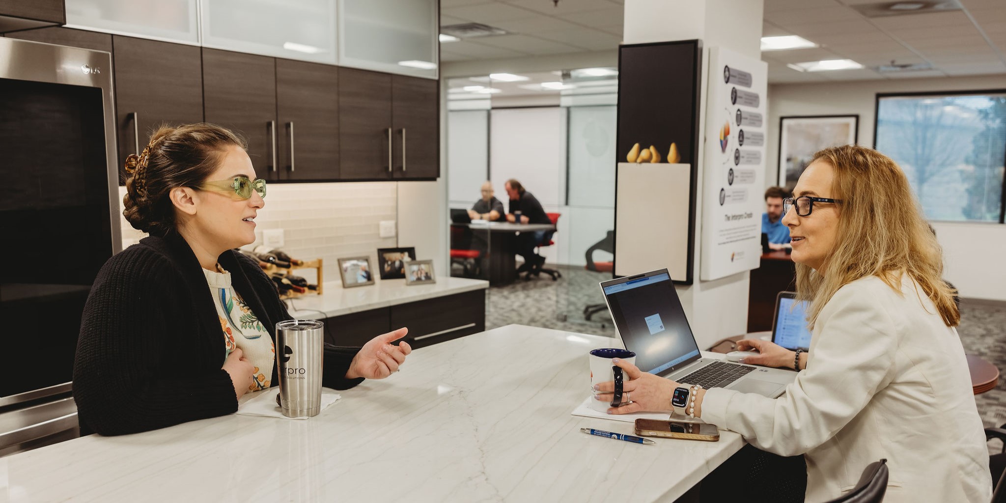 Two professionals discussing translation project instructions at a modern office, emphasizing clarity and consistency for successful global localization.