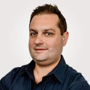 Nick Strozza, is CEO at Interpro, smiling in a professional headshot wearing a black polo shirt.
