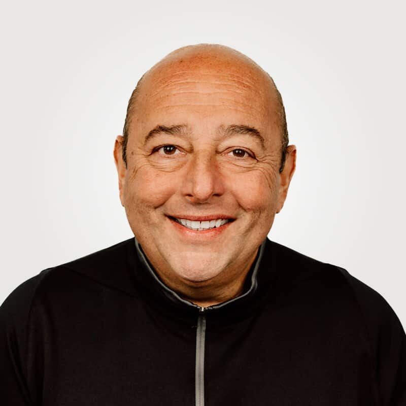 Ralph Strozza, is Founder and Consigliere at Interpro, smiling in a professional headshot wearing a black polo shirt.