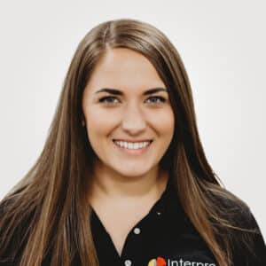 Valerie Lagueux, in project management at Interpro, smiling in a professional headshot wearing a black polo shirt.