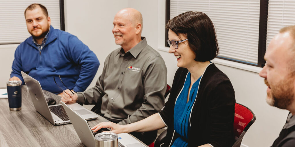 Interpro team collaborating in a meeting to showcase localization expertise and technology capabilities.