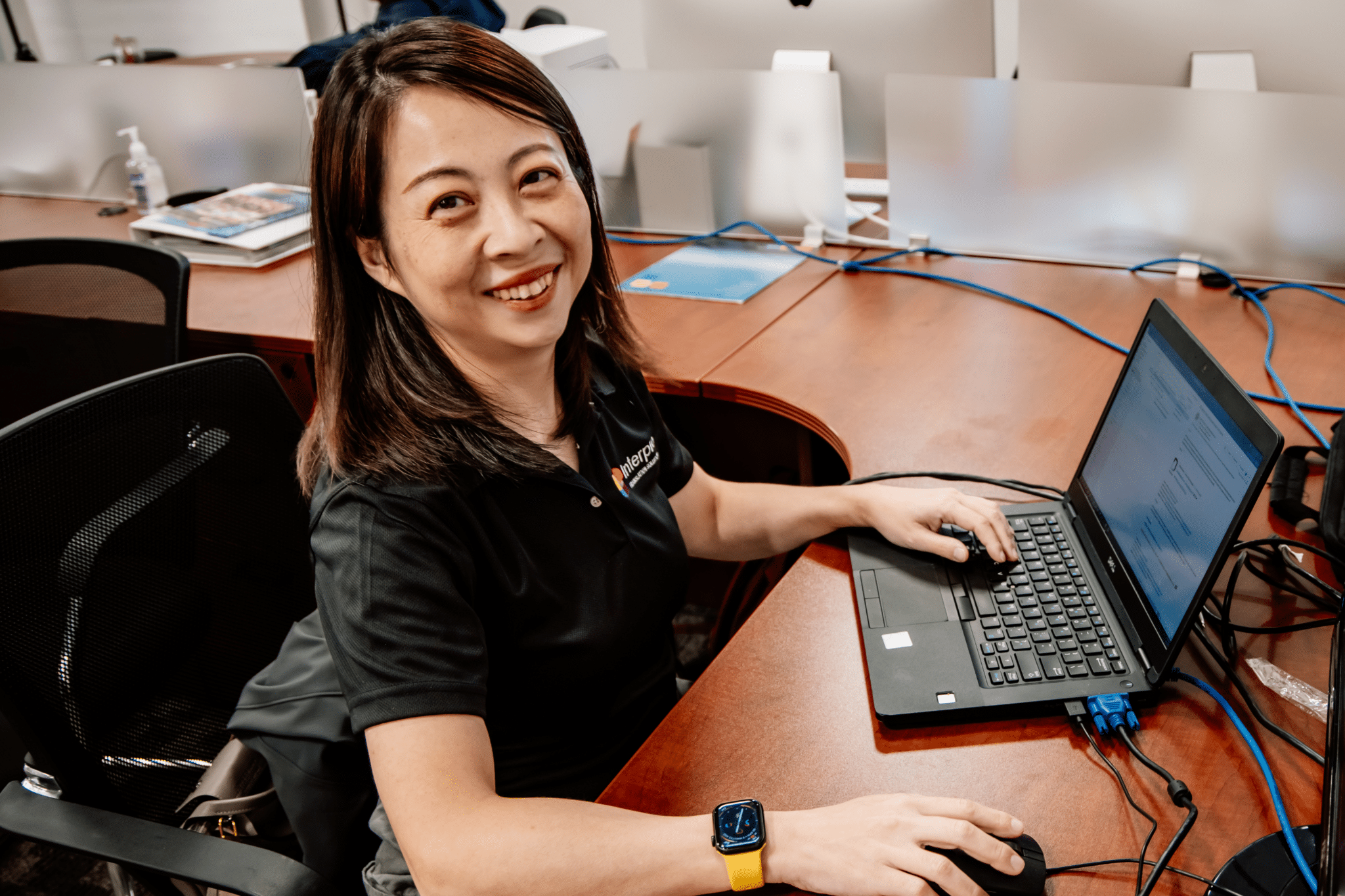 Interpro Translation Solutions project manager working on multilingual content at her desk